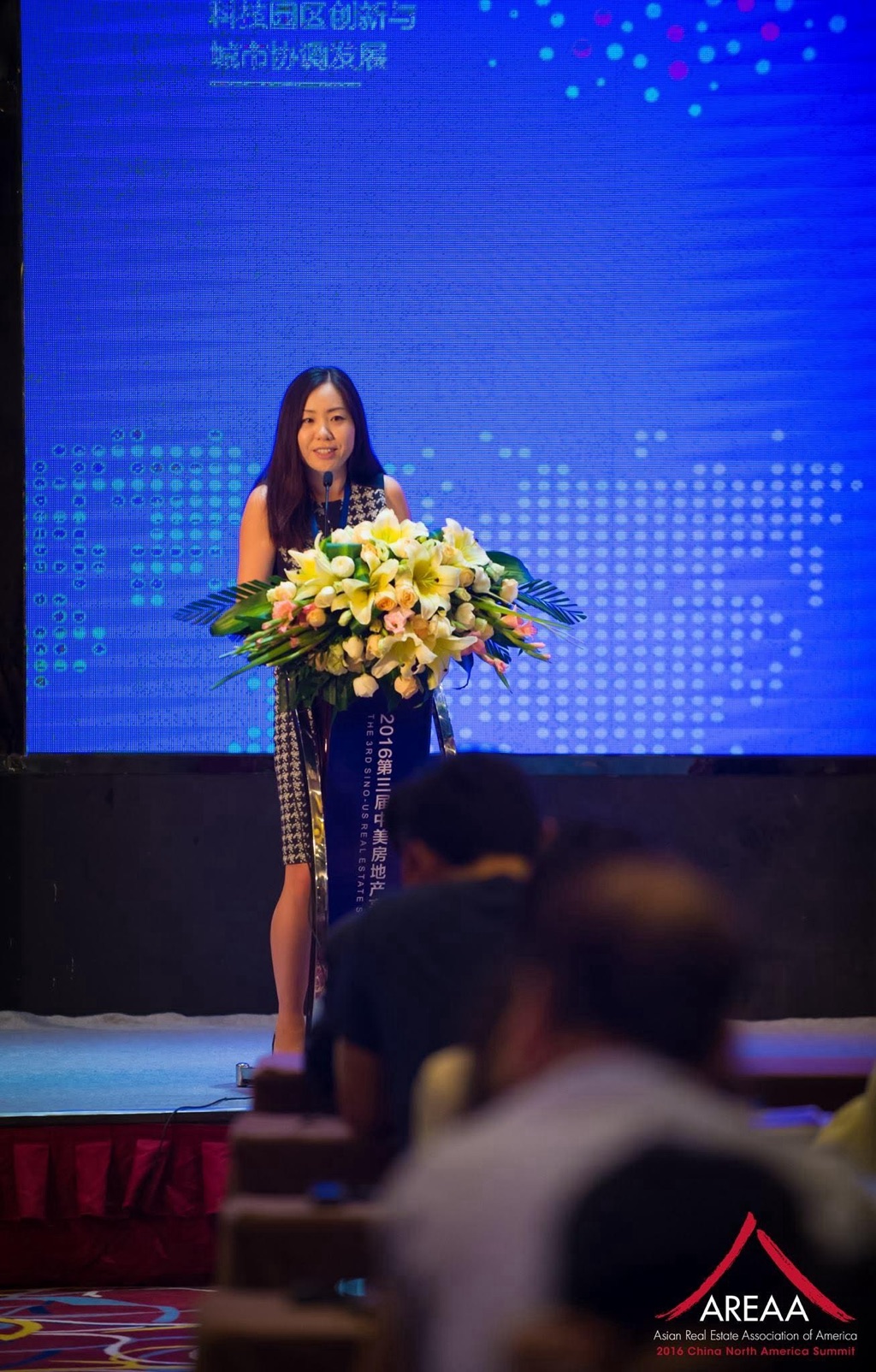 Angie Lee delivering an AREAA Global & Luxury keynote